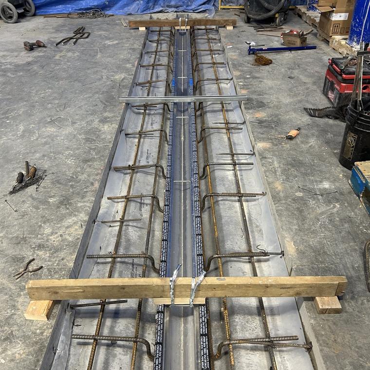 Stainless drain assembly positioned over rebar before a concrete pour